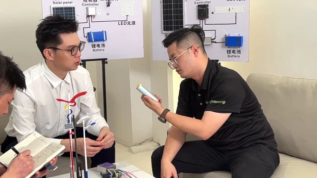 Engineering team analyzing custom solar street light project requirements