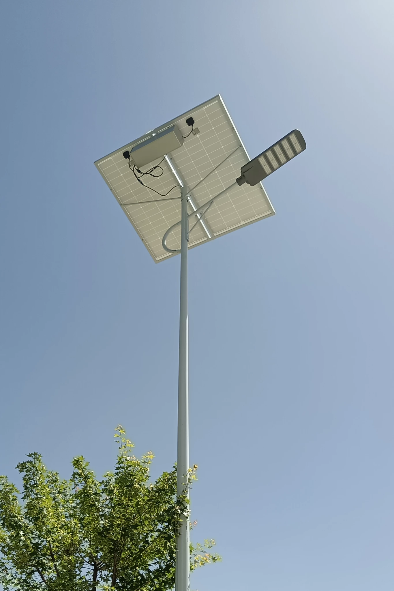 Solar street lighting infrastructure project with integrated LED solar street lights installed on roadway
