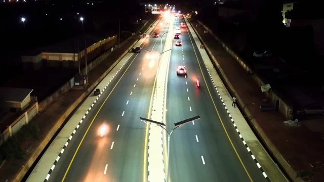solar street lighting system illuminating a highway at night